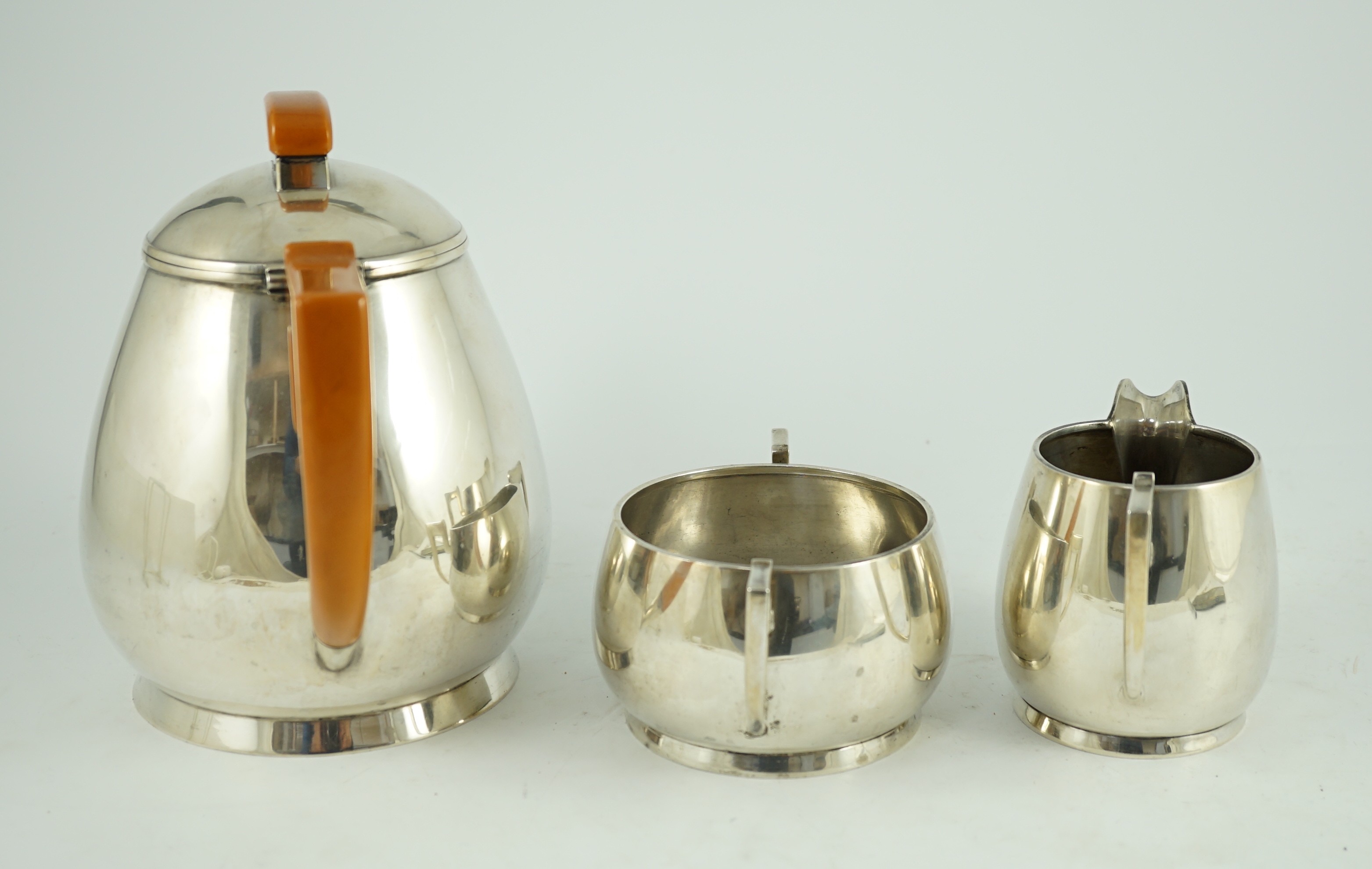 A stylish George VI silver three piece tea set, by Ls Sl